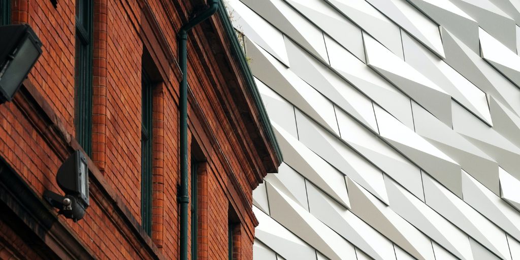 Juxtaposition photography examples - vintage brick building and modern building